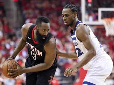 Rockets' James Harden is defended by Timberwolves' Andrew Wiggins (22) in game five. Reuters