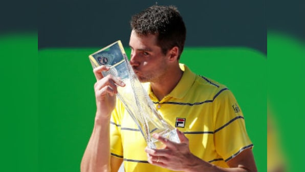 Miami Open: John Isner fights back from a set down against Alexander Zverev to clinch first Masters title