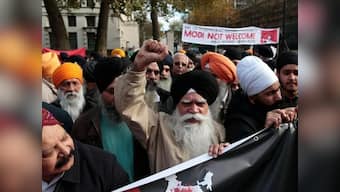 Protesters tear Indian Tricolour outisde British Parliament: UK govt apologises after anti-Narendra Modi protests in London