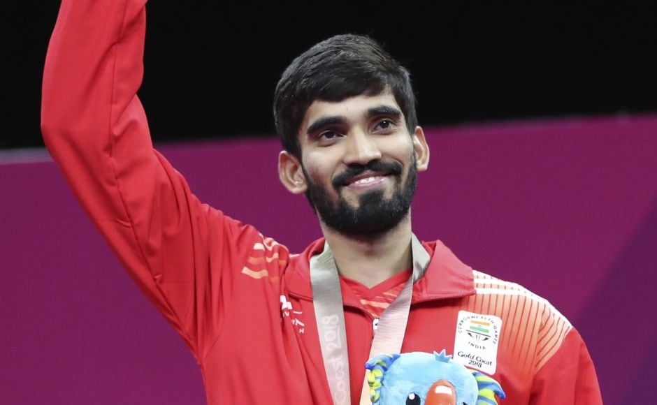 Silver medalist Srikanth Kidambi of India waves at supporters during the medal ceremony for men's singles badminton at Gold Coast. AP Silver medalist Srikanth Kidambi of India waves at supporters during the medal ceremony for men's singles badminton at Gold Coast. AP