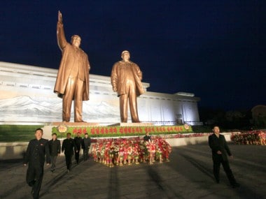 North Koreans visit the Mansu Hill to lay floral baskets and flowers to the statues of Kim Il Sung and Kim Jong Il on Saturday. AP