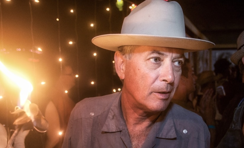 This Aug. 30, 2011 photo shows Larry Harvey, co-founder of the Burning Man festival, during a party at Media Mecca, the communications center during the festival in the Black Rock Desert in Northern Nevada. Burning Man Project CEO Marian Goodell says Harvey died Saturday, April 28, 2018 at a hospital in San Francisco. He was 70. (John Curley via AP)
