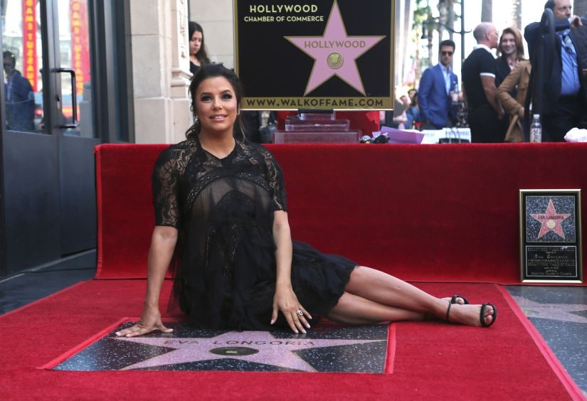 Eva Longoria poses with her star on the Hollywood Walk of Fame following a ceremony on Monday, April 16, 2018, in Los Angeles. (Photo by Willy Sanjuan/Invision/AP)