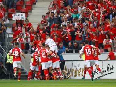 Mainz's Bote Baku celebrates scoring their third goal against RB Leipzig with teammates. Reuters
