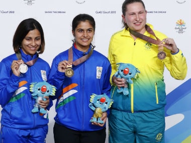 Gold medallist Manu Bhaker of India (C) , silver medallist Heena Sidhu of India and bronze medalist Elena Galiabovitch pose with their medals. Reuters
