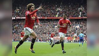 Premier League: Manchester United seal qualification for next season's Champions League with late win over Arsenal