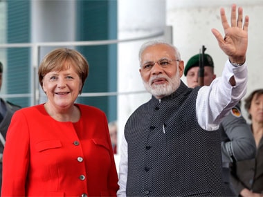 German Chancellor Angela Merkel, left, welcomes India's Prime Minister Narendra Modi, right, for a meeting at the chancellery in Berlin. AP