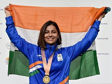 Heena Sidhu holds tricolour during the medal ceremony after winning gold in the Womens 25m Pistol final. PTI