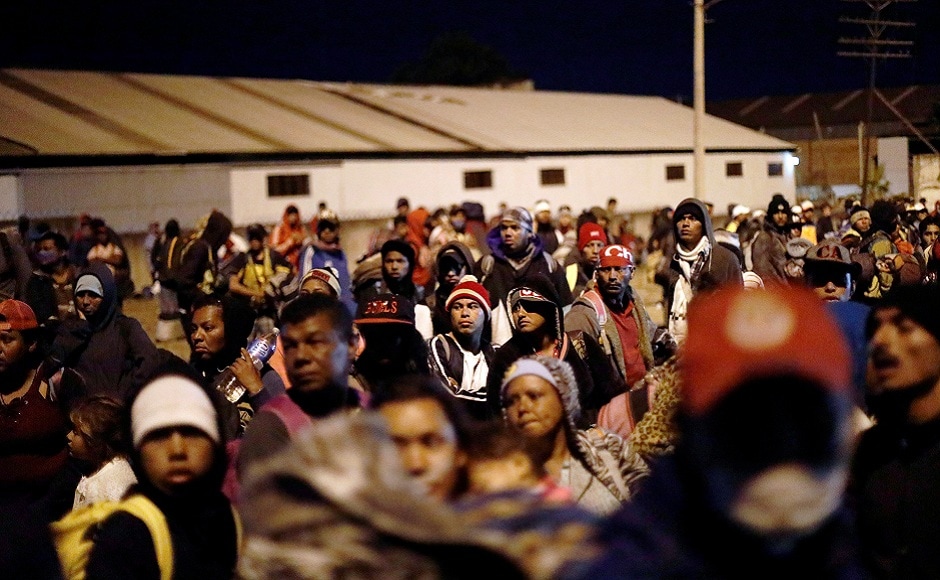 Central American migrants, moving in a caravan through Mexico, wait next to a railway before embarking on a new leg of their travels, in Tlaquepaque, in Jalisco state, Mexico. REUTERS Central American migrants, moving in a caravan through Mexico, wait next to a railway before embarking on a new leg of their travels, in Tlaquepaque, in Jalisco state, Mexico. REUTERS