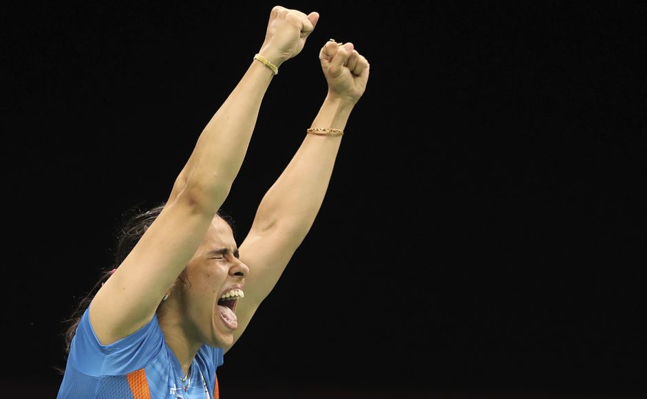 Saina Nehwal celebrates after beating PV Sindhu in final to win gold in the women's Badminton singles final at the Commonwealth Games at Gold Coast. AP Saina Nehwal celebrates after beating PV Sindhu in final to win gold in the women's Badminton singles final at the Commonwealth Games at Gold Coast. AP