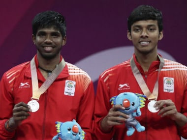 Silver medalists Satwik Rankireddy, left, and Chirag Shetty of India, stand on the podium during the medal ceremony for men's doubles badminton Gold Coast. AP