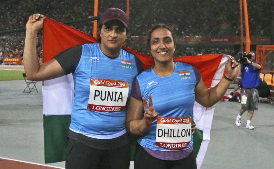 Silver medalist for the women's discus throw India's Seema Punia, left, and bronze medalist and compatriot Navjeet Dhillon celebrate with their national flag. AP Silver medalist for the women's discus throw India's Seema Punia, left, and bronze medalist and compatriot Navjeet Dhillon celebrate with their national flag. AP