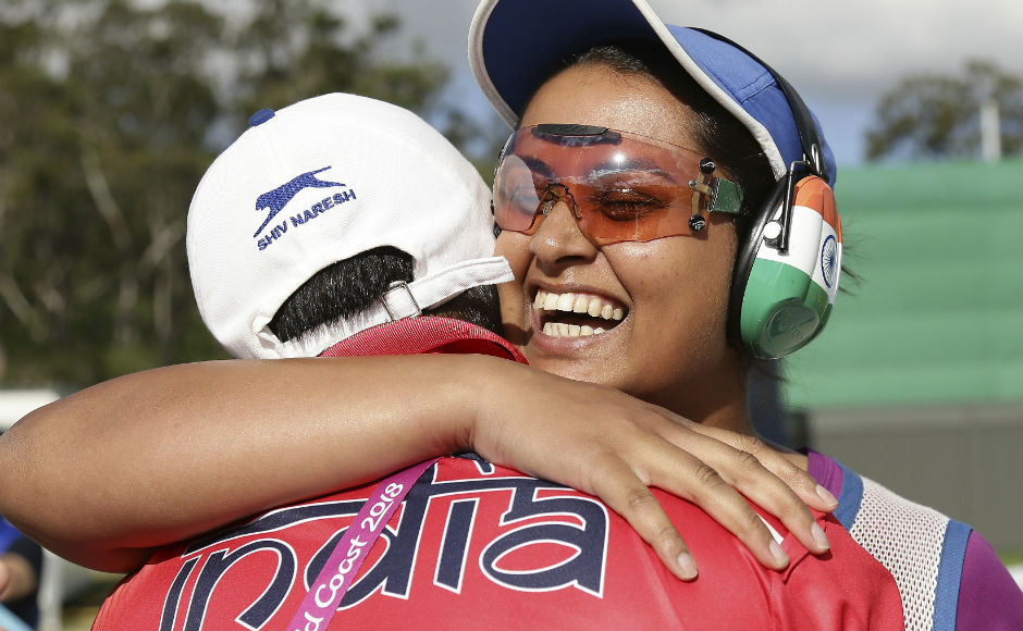 Shreyasi Singh of India, right, is hugged by her coach Mansher Singh after she won the gold medal. AP Shreyasi Singh of India, right, is hugged by her coach Mansher Singh after she won the gold medal. AP