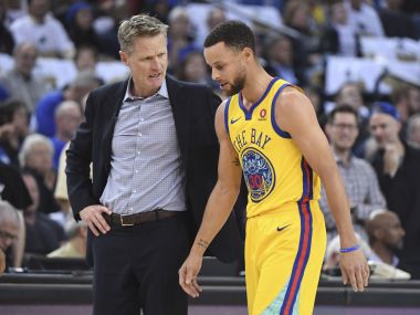 File photo of Golden State Warriors head coach Steve Kerr (left) and Stephen Curry. Reuters