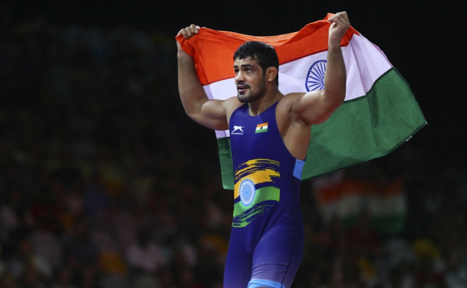 India's Sushil Kumar celebrates soon after wining in men's FS 74Kg wrestling against South Africa's Johannes Botha. AP India's Sushil Kumar celebrates soon after wining in men's FS 74Kg wrestling against South Africa's Johannes Botha. AP