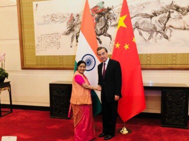 Sushma Swaraj with Foreign Minister of China Wang Yi in Beijing on Sunday. Twitter@EOIBeijing
