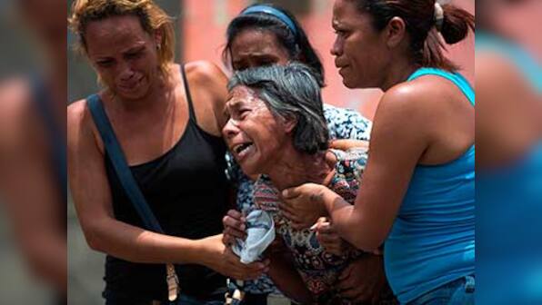 Venezuelan authorities arrest five police officials over fire, riots in police jail cell that killed 68 people