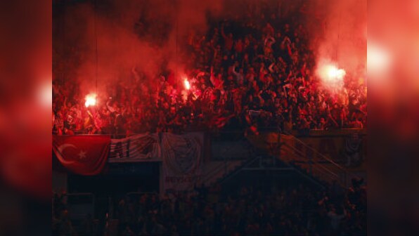 Turkish football under the spotlight again for fans’ misbehaviour after Besiktas coach Senol Gunes hit by object
