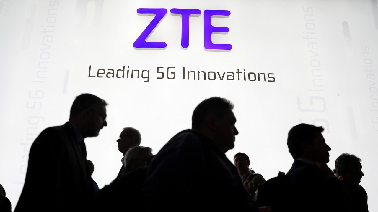Visitors pass in front of the Chinese telecoms equipment group ZTE. Reuters