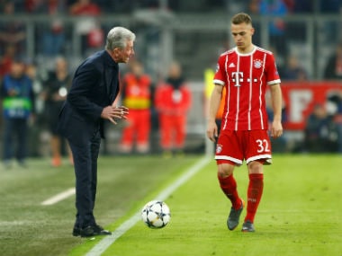File photo of Bayern Munich coach Jupp Heynckes (L) giving instructions to Joshua Kimmich. Reuters