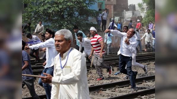 Bharat Bandh: Dalit stir turns violent in Uttar Pradesh as protesters attack shops, pelt stones at police