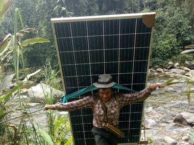 A man carrying equipment for electrification of villages. Image courtesy: Twitter/@narendramodi