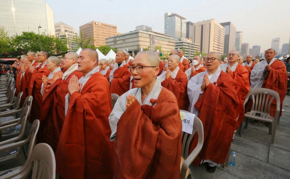 Alongside, South Koreans and Buddhist monks prayed during a service to support the summit between Kim and Moon. The two Koreas have agreed for South Korea's president to visit Pyongyang sometime this autumn. AP Alongside, South Koreans and Buddhist monks prayed during a service to support the summit between Kim and Moon. The two Koreas have agreed for South Korea's president to visit Pyongyang sometime this autumn. AP
