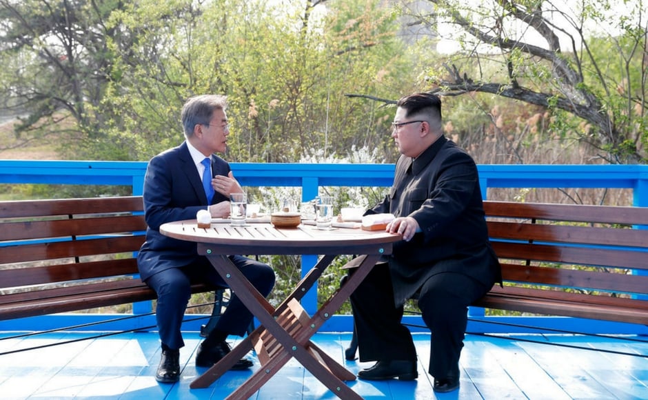 The leaders then talked while walking unaccompanied on a nearby bridge in Panmunjom. A joint statement issued after the talks said the two nations confirmed their goal of achieving The leaders then talked while walking unaccompanied on a nearby bridge in Panmunjom. A joint statement issued after the talks said the two nations confirmed their goal of achieving