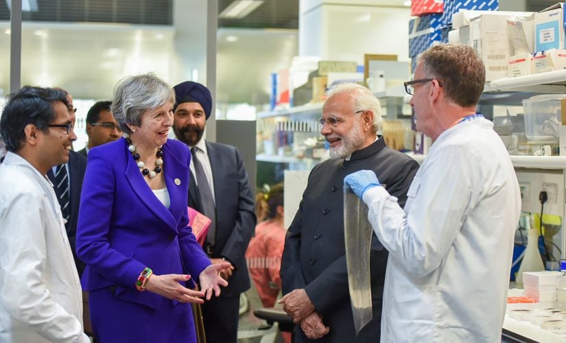 Prime Minister Narendra Modi with British Prime Minister Theresa May visits the Francis Crick Institute in London on Wednesday. PTI