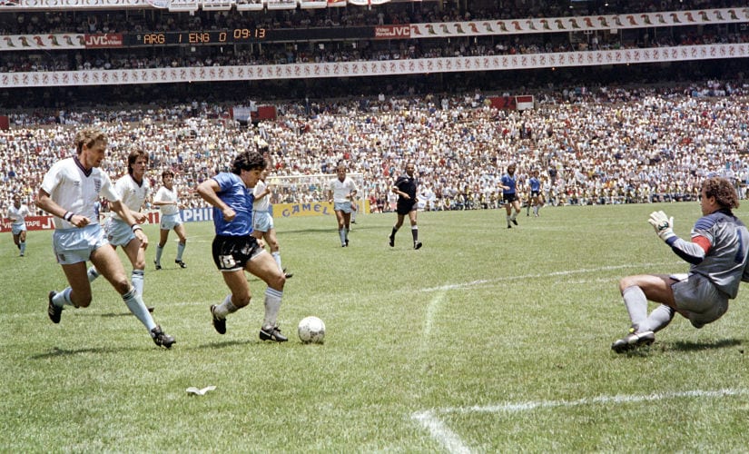 Argentinian forward Diego Armando Maradona (3rd L) runs past English defender Terry Butcher (L) on his way to dribbling goalkeeper Peter Shilton (R) and scoring his second goal, or goal of the century, during the World Cup quarterfinal soccer match between Argentina and England on June 22, 1986 in Mexico City. Argentina advanced to the semifinals with a 2-1 victory. / AFP PHOTO / STAFF