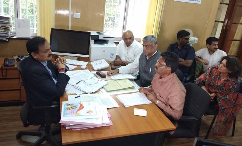Rajeev Gowda with Chief Electoral Officer Sanjiv Kumar. Image courtesy Y Maheswara Reddy