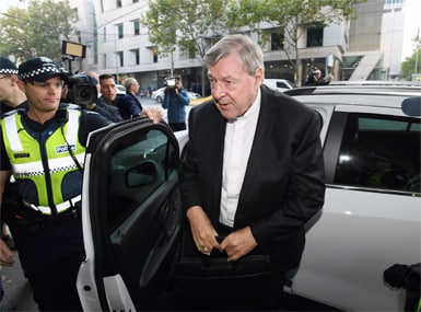Australian Cardinal George Pell arrives at the Magistrates Court in Melbourne, Australia, on Tuesday