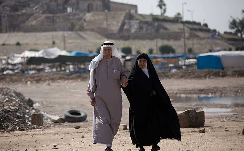 The three main ethnic and religious groups — the majority Shi’ite Arabs and minority Sunni Arabs and Kurds — have been at odds for decades, and sectarian divisions remain as deep as ever even though they joined forces to fight IS. An Iraqi couple arrives to cast their ballots in the parliamentary elections at a polling site in the shadow of the Nebi Younis shrine, destroyed by Islamic State militants during their three-year reign in Mosul. AP The three main ethnic and religious groups — the majority Shi’ite Arabs and minority Sunni Arabs and Kurds — have been at odds for decades, and sectarian divisions remain as deep as ever even though they joined forces to fight IS. An Iraqi couple arrives to cast their ballots in the parliamentary elections at a polling site in the shadow of the Nebi Younis shrine, destroyed by Islamic State militants during their three-year reign in Mosul. AP