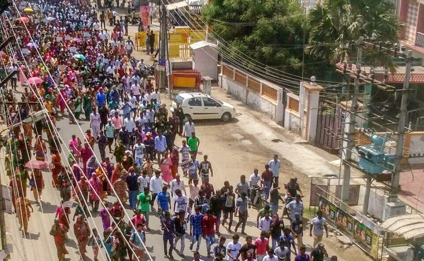 Agitators march through a street during anti-sterlite protests in Tuticorin. PTI