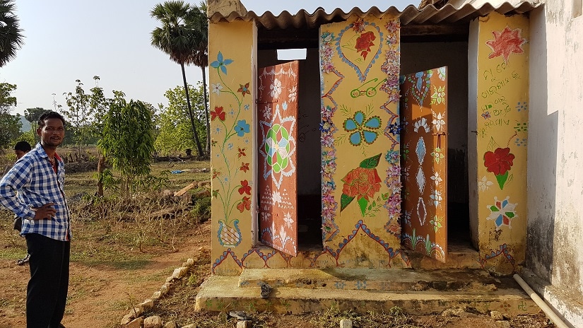 A villager in Kirtanpali village of Deogarh district in Odisha with his colourfully painted toilet. Image courtesy Manish Kumar