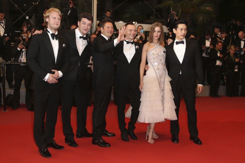 Producers Ilya Stewart, from left, Charles-Evrard Tchekhoff, director of photography Vladislav Opelyants, actors Roma Zver, Irina Starshenbaum and Teo Yoo pose for photographers upon arrival at the premiere of the film 'Leto' at the 71st international film festival, Cannes, southern France, Wednesday, May 9, 2018. (Photo by Joel C Ryan/Invision/AP)