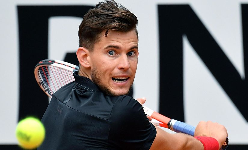 Austria's Dominic Thiem returns a backhand to Italy's Fabio Fognini during their Italian Open tennis tournament match, in Rome, Wednesday, May 16, 2018. (Ettore Ferrari/ANSA via AP)