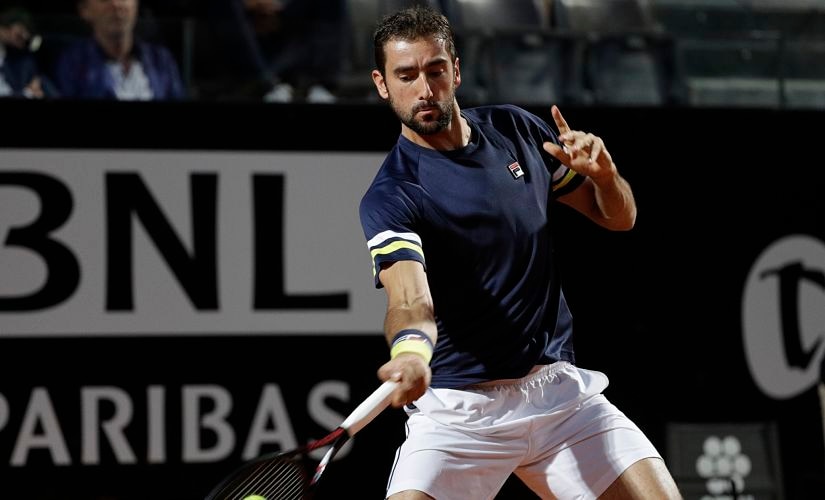 Croatia's Marin Cilic returns a ball to Germany's Alexander Zverev, during their semifinal match at the Italian Open tennis tournament in Rome, Saturday, May 19, 2018. (AP Photo/Gregorio Borgia)