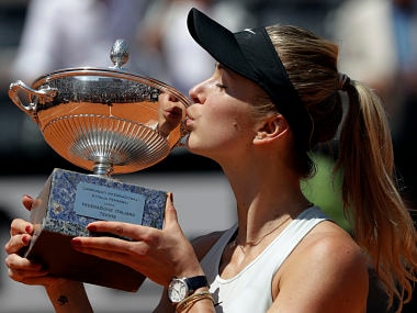 Ukraine's Elina Svitolina kisses the trophy after winning her final match against Simona Halep at the Italian Open tennis tournament, in Rome, Sunday, May 20, 2018. Svitolina won 6-0, 6-4. (AP Photo/Gregorio Borgia)