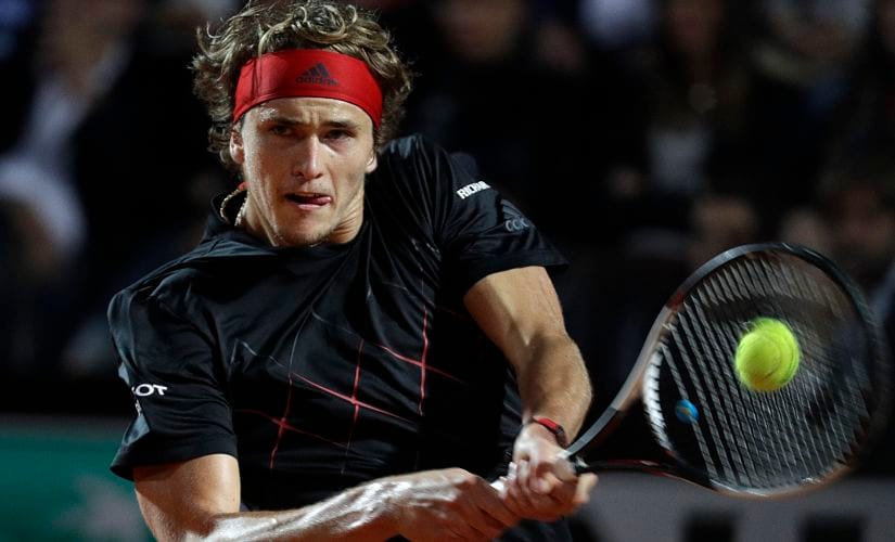 FILE - In this May 19, 2018, file photo, Germany's Alexander Zverev returns the ball to Croatia's Marin Cilic during their semifinal match at the Italian Open tennis tournament in Rome. Zverev will be competing in the French Open tennis tournament that begins on Sunday, May 27. (AP Photo/Gregorio Borgia, File)