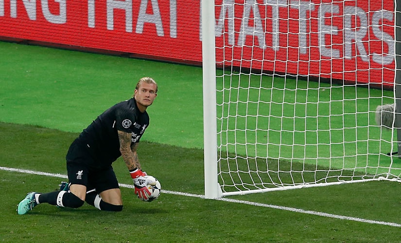 Liverpool goalkeeper Loris Karius holds the ball after Real Madrid's Gareth Bale scored his side's 2nd goal during the Champions League Final soccer match between Real Madrid and Liverpool at the Olimpiyskiy Stadium in Kiev, Ukraine, Saturday, May 26, 2018. (AP Photo/Darko Vojinovic)
