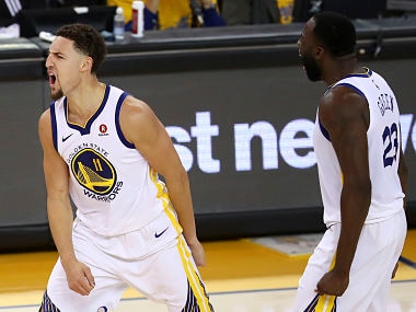 Golden State Warriors guard Klay Thompson (11) celebrates with forward Draymond Green during the second half of Game 6 of the NBA basketball Western Conference Finals against the Houston Rockets in Oakland, Calif., Saturday, May 26, 2018. (AP Photo/Ben Margot)