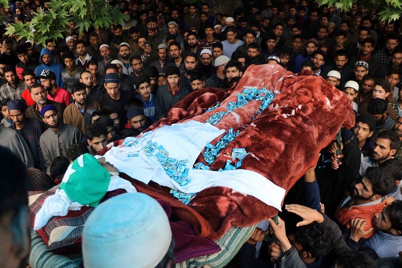 People carry the body of teenager Umar Ahmad Kumar  in Pinjoora village of Shopian district on Thursday. Image courtesy Hilal Shah
