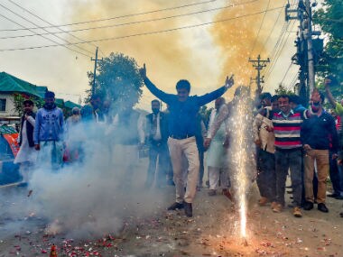 BJP workers celebrate saffron party's performance in Karnataka. PTI