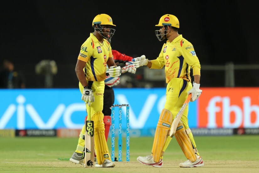 Chennai Super Kings’ Dwayne Bravo and MS Dhoni fist bump during the match against Royal Challengers Banglore. Sportzpics 