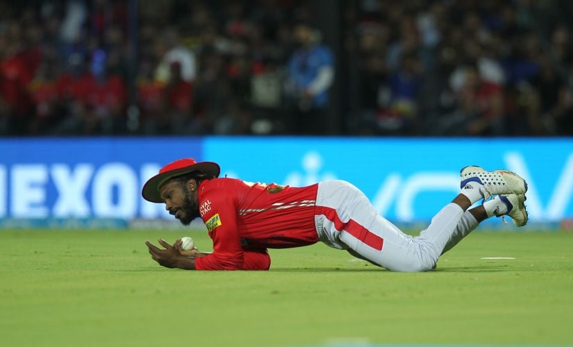 Chris Gayle dives to catch Ajinkya Rahane on Sunday. Sportzpics 