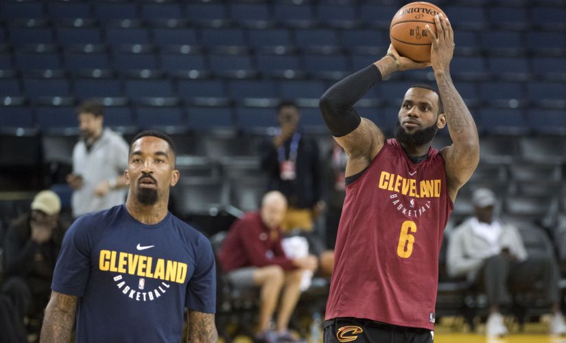 Cleveland Cavaliers' LeBron James (right) shoots the basketball next to JR Smith before the 2018 NBA Finals. Reuters