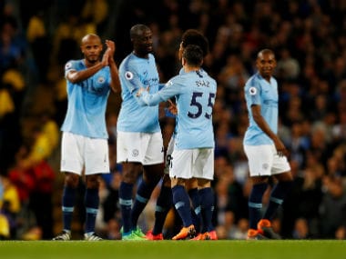 Manchester City's Yaya Toure with teammates he is substituted off against Brighton. Reuters