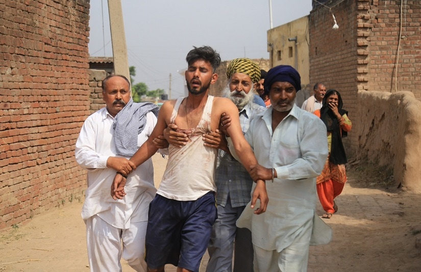 A man crying after his brother was injured in the firing in Arnia village. Image courtesy Mir Imran