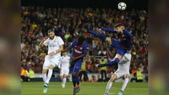 La Liga: 10-man Barcelona protect unbeaten record against Real Madrid in fast and furious El Clasico